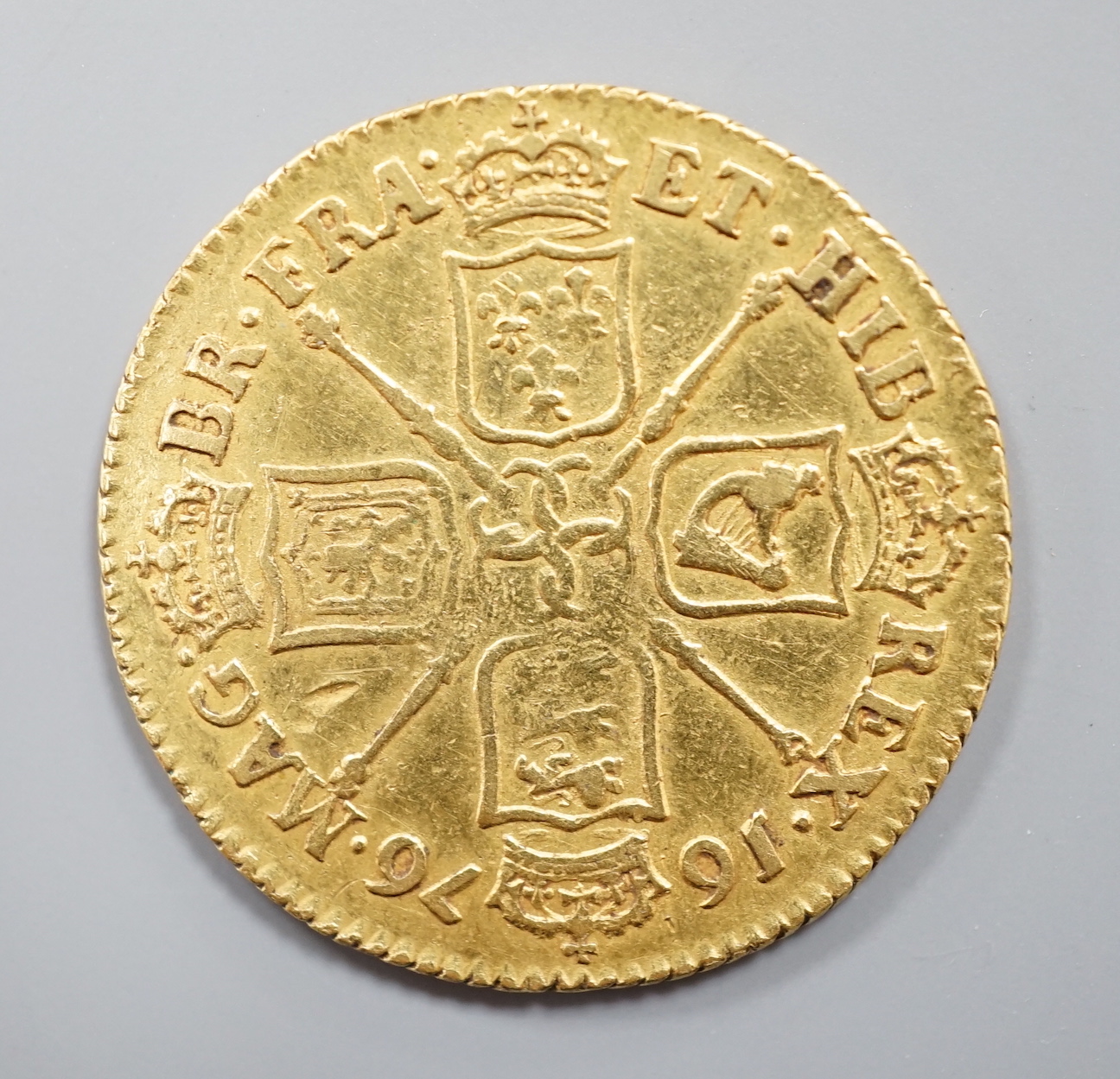 A Charles II gold guinea, 1676, F/VF.